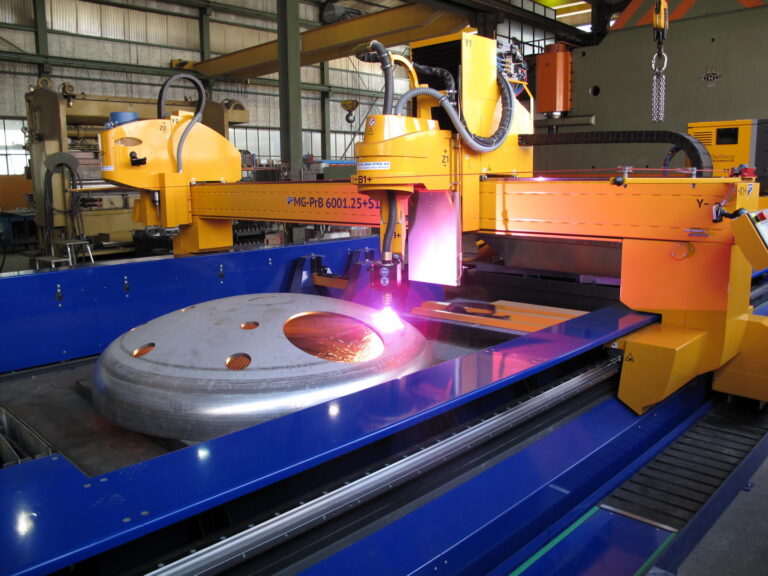 Steel dome being cut by a plasma rotator on an MG machine