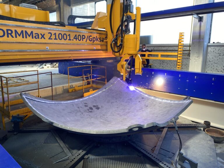 Machine cutting piece of dome